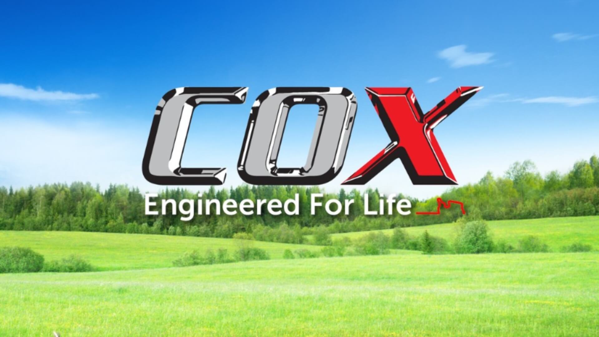 Green field and blue sky with the Cox logo over the top.