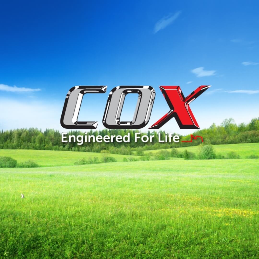 COX logo with a scenic background of a grassy field and blue sky.