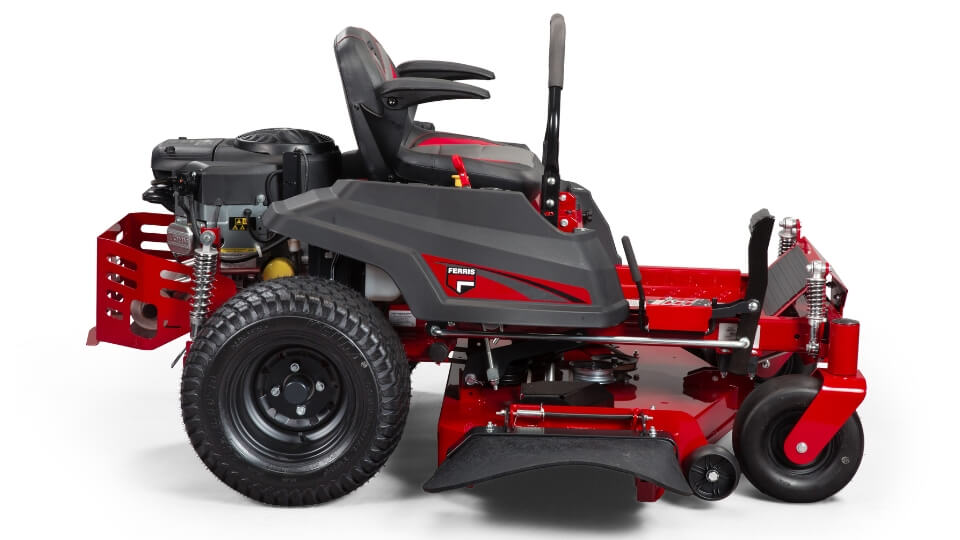 Side view of red Ferris ride on mower showing large rear wheels with tread, seat, lap bar, engine and suspension on a white background.