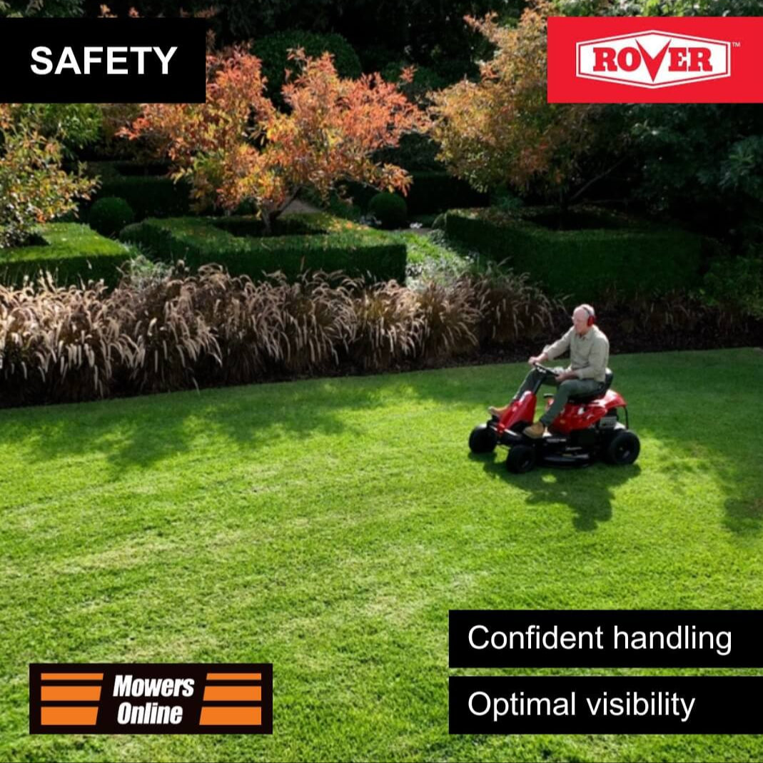 Man riding a red lawnmower on a green lawn with 'Rover' branding and safety features text.