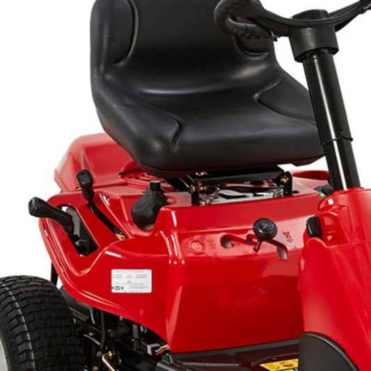 Close-up of a red riding lawn mower with black seat and handle on a white background