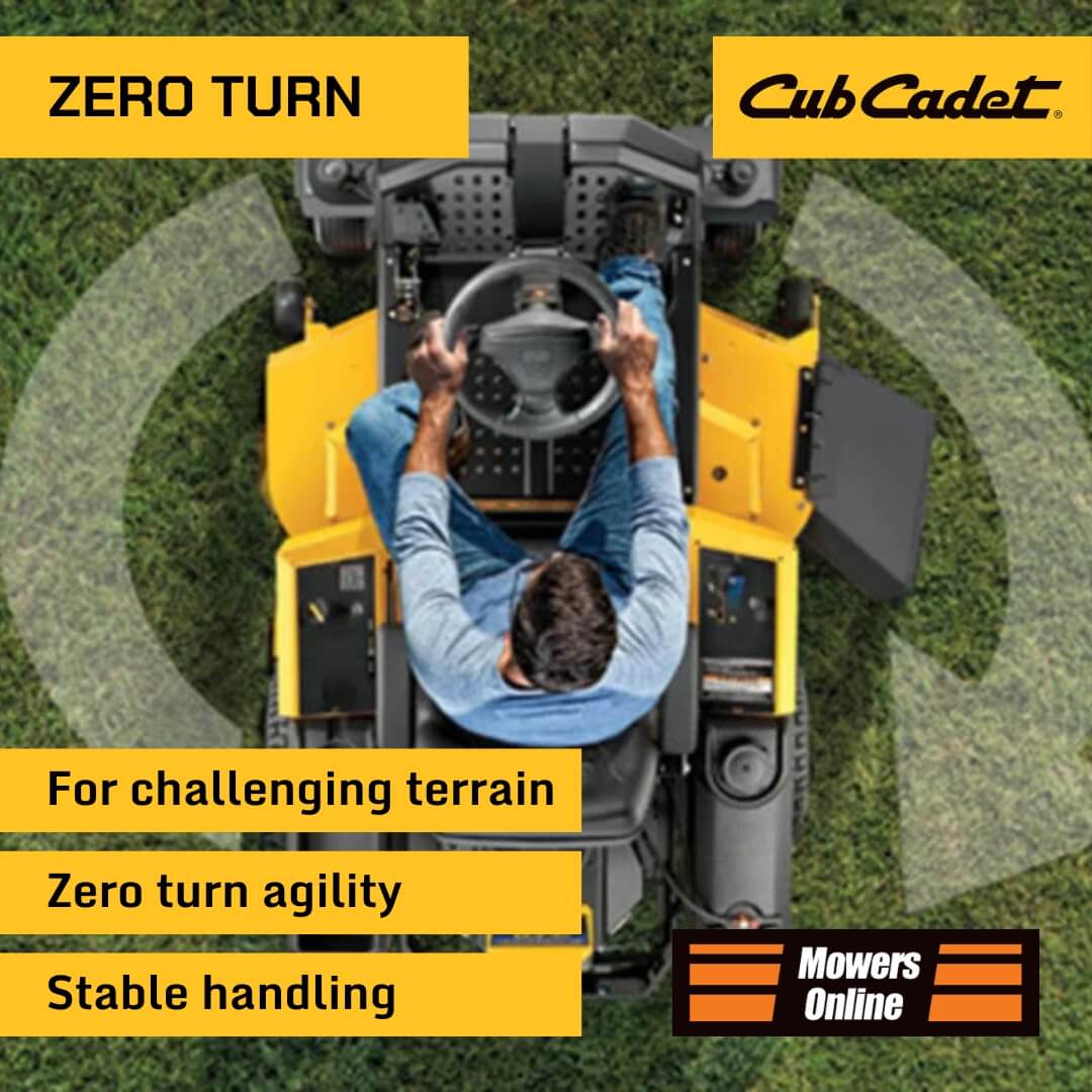 Cub Cadet zero turn lawn mower with a person inside, on grass.