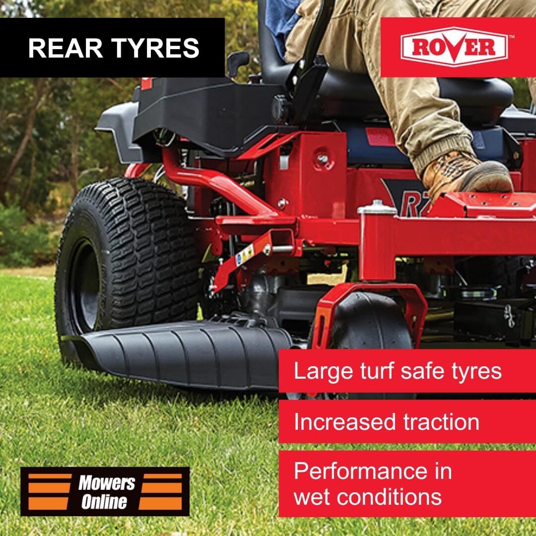 Red riding lawn mower with large turf safe tyres on grass, featuring Rover branding.